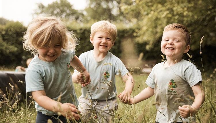 Children playing in grass fields