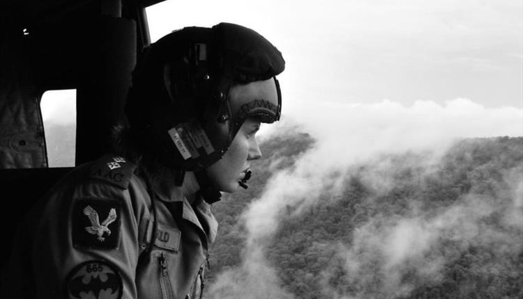 woman looking out from plane