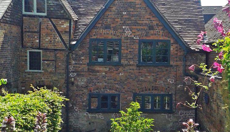 old brick house with formal garden