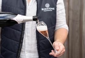 Bluestone sparkling rosé being poured into a glass