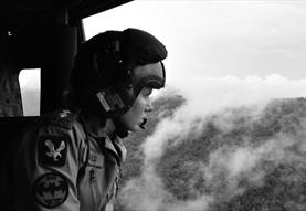 woman looking out from plane