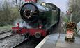 steam loco 6695 approaching platform with Santa special headboard and Christmas decorations