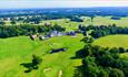 Bowood hotel from above surrounded by green fields