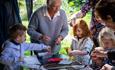 children outside doing arts and crafts