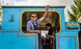 steam locomotive footplate crew smiling and waving from cab