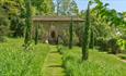Exterior of the cloisters at Iford Manor Gardens, near Bath.