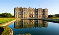 view of Longleat House, with reflection in fountain