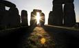 The sun shining at Stonehenge