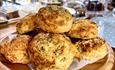 Cheese scones on a wooden plate.