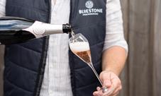 Bluestone sparkling rosé being poured into a glass