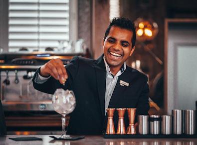 Barman making cocktails