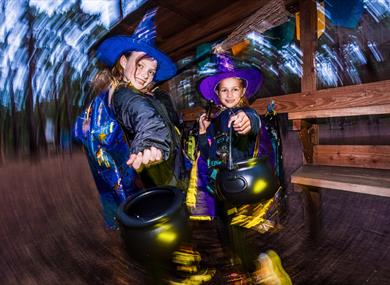 Halloween Potion Hunt at Go Ape Bracknell - two girls in fancy dress as witches with their cauldrons
