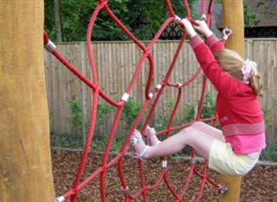 Child in play area at Cliveden