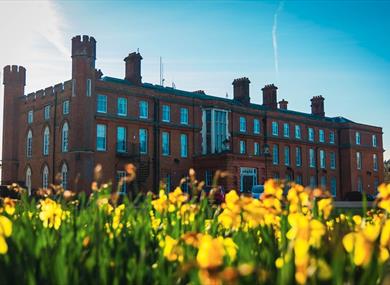 Cumberland Lodge with daffodils in the foreground