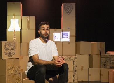 It’s the Economy, Stupid! - Man sat in front of cardboard boxes