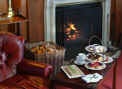 Festive Afternoon Tea in front of fire at Cumberland Lodge