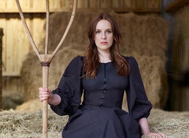 Kate Norris in a barn