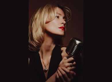 Rebecca Poole with a microphone