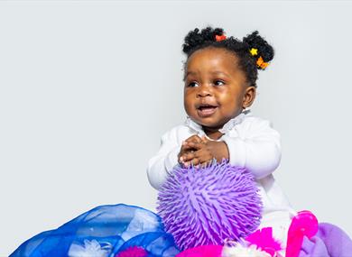 Soft or Spiky - Young girl playing with toys and cloth - ©Steve Gregson