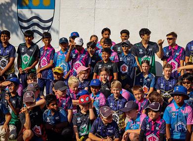 A group of boys and girls in all their team kits for C6