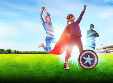 Superheroes with a child at Windsor Racecourse