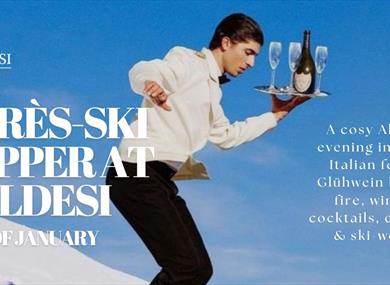 Waiter skiing with tray of drinks