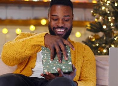 Man opening a gift
