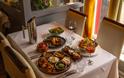 An oriental dinner feast for two, complete with two glasses of wine