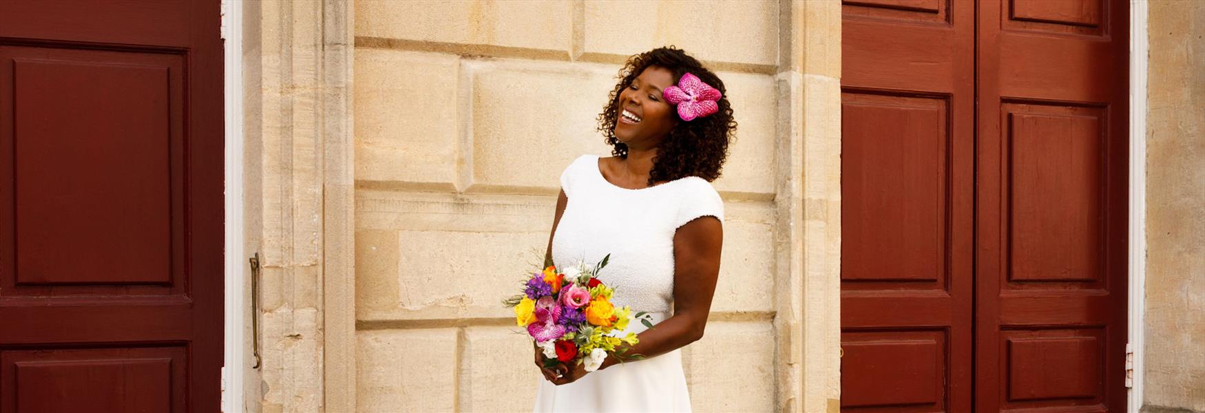 Bride by the red doors of Windsor Guildhall