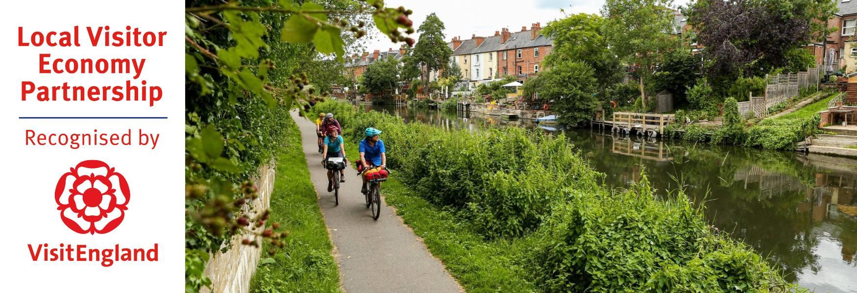 People cycling along the canal in Reading