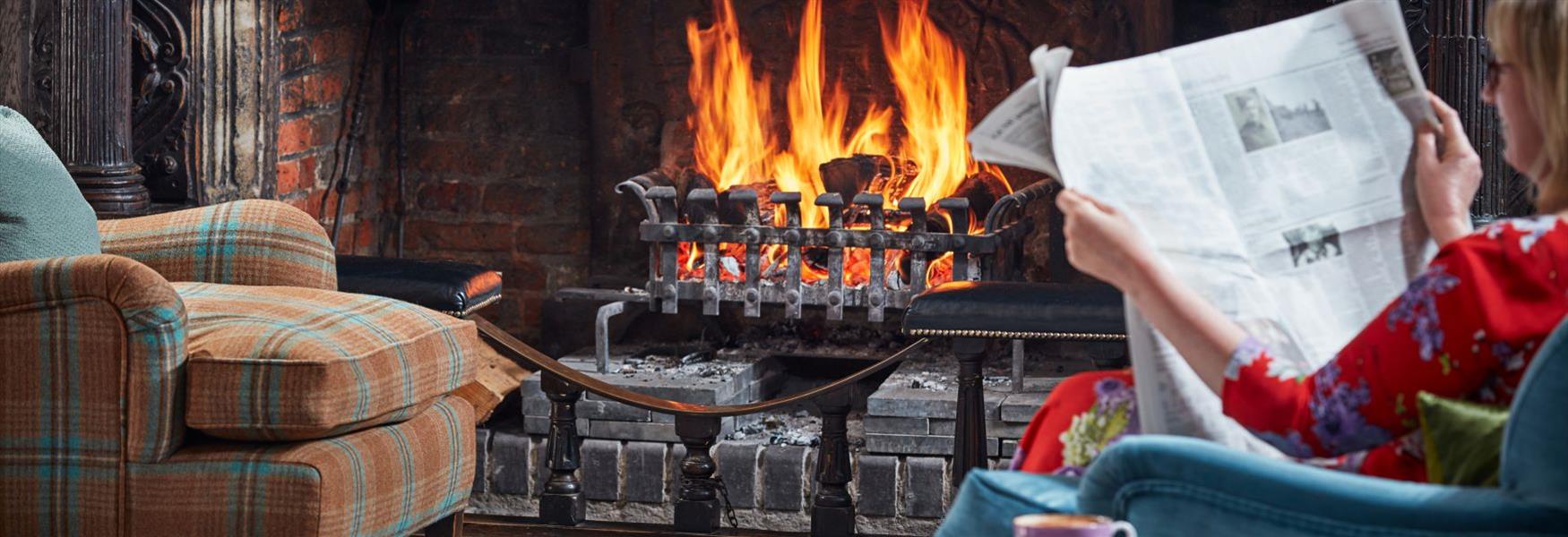 Great Fosters Main Hall by an open fire