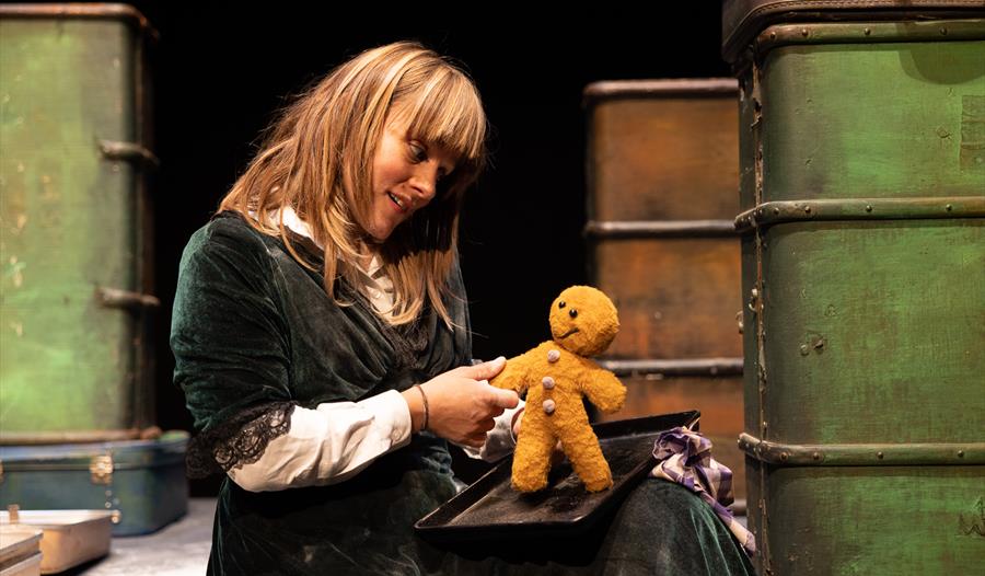 The Gingerbread Man - Lady holding a soft toy Gingerbread Man