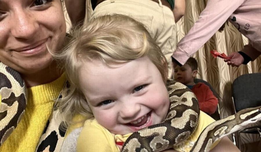 Toddler with snake