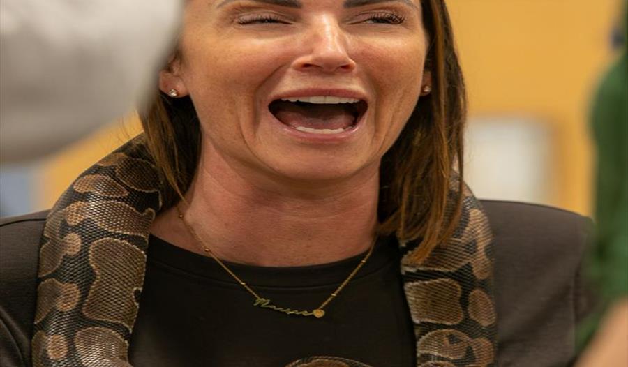 Woman with snake around neck