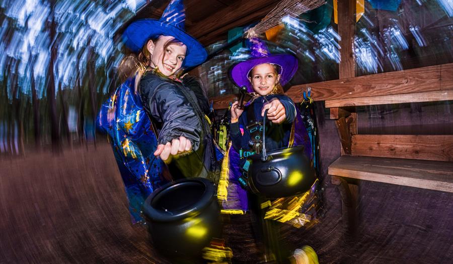 Halloween Potion Hunt at Go Ape Bracknell - two girls in fancy dress as witches with their cauldrons
