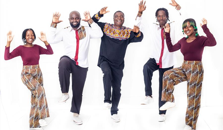 Black Umfolosi dancing hands in the air