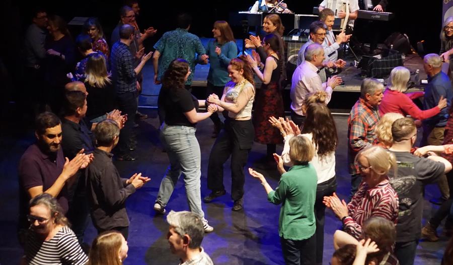 Burns Night Ceilidh ©Andrew Scotland - group dancing in front of traditional band