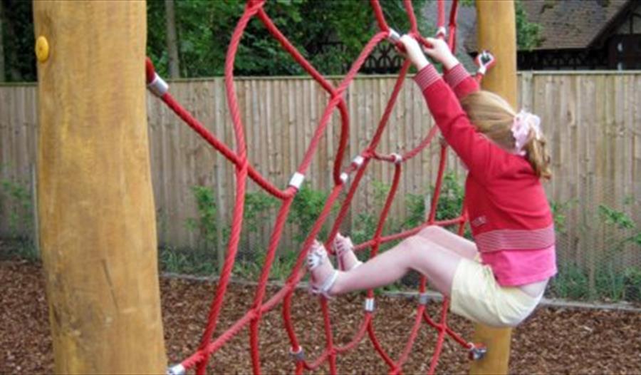 Child in play area at Cliveden