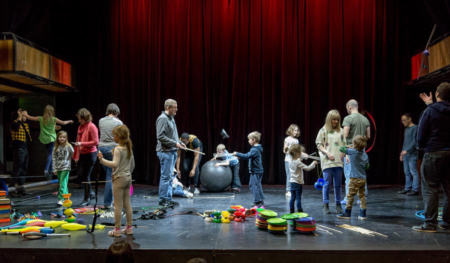 Families learning circus skills