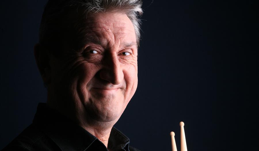Dave Barry - portrait holding drumsticks