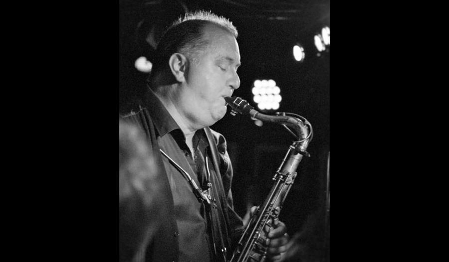 Frank Griffith playing sax in black and white
