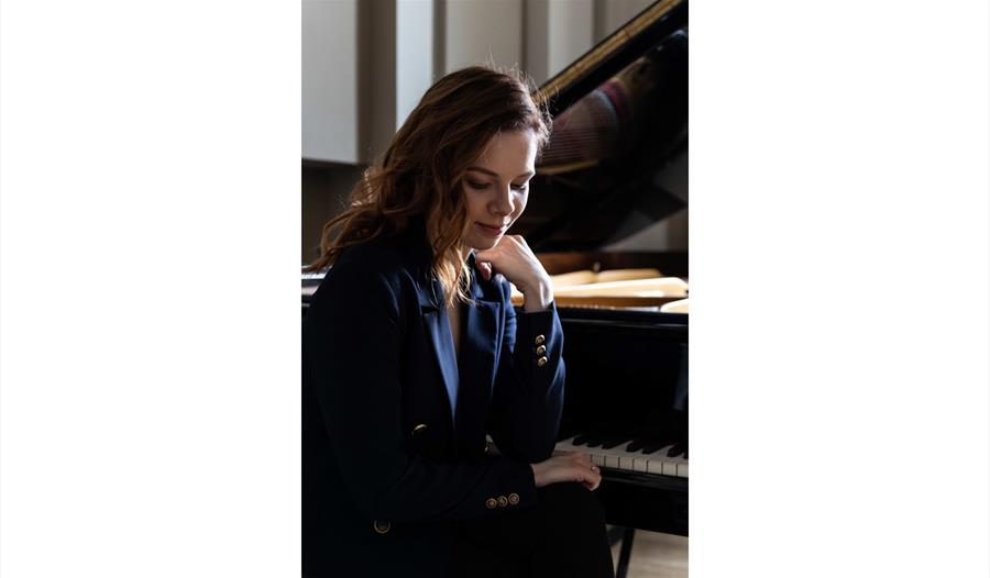 Gabrielé Sutkuté sat at a piano