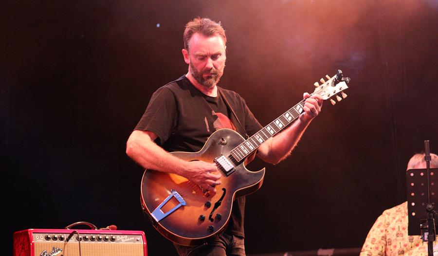 Hugh Turner playing guitar