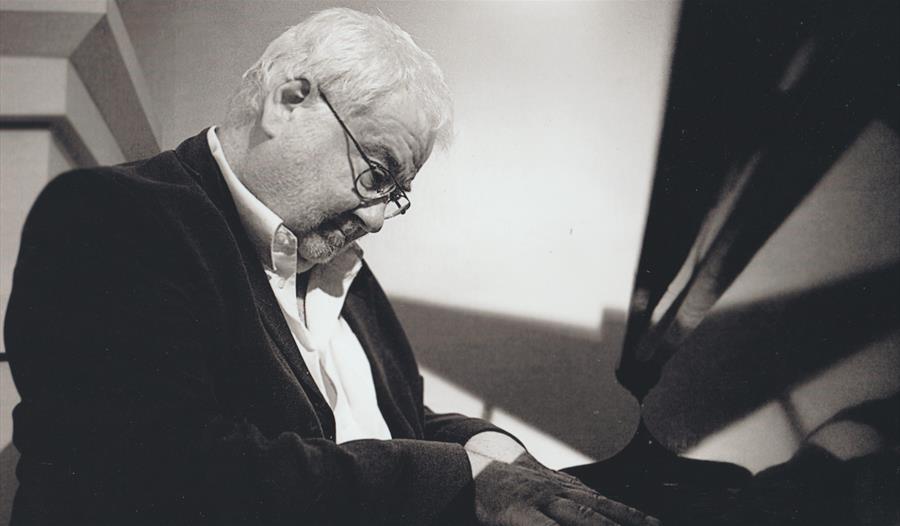 John Horler - playing piano, black and white
