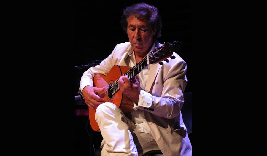 Juan  Martin, sat on stage playing Spanish guitar
