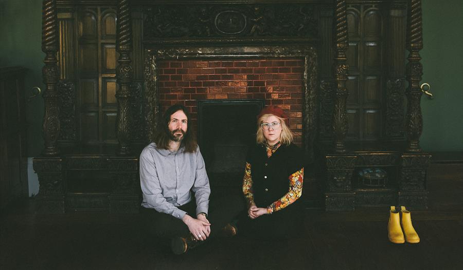 M G Boulter and Samantha Whates - sat in front of grand fireplace