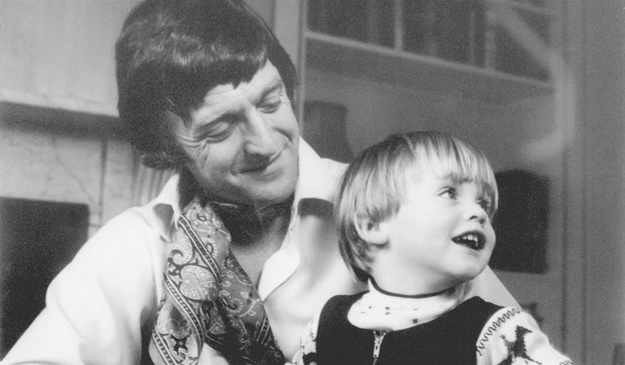 Black and white photo of Michael Parkinson and son Mike