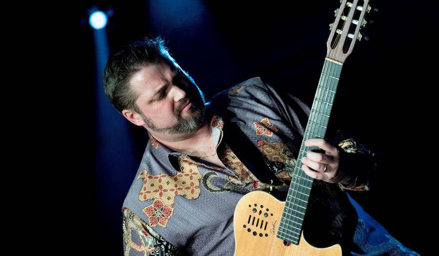 Nic Meier playing guitar