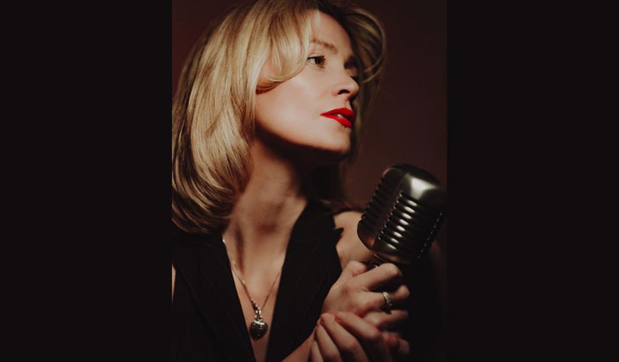 Rebecca Poole with a microphone