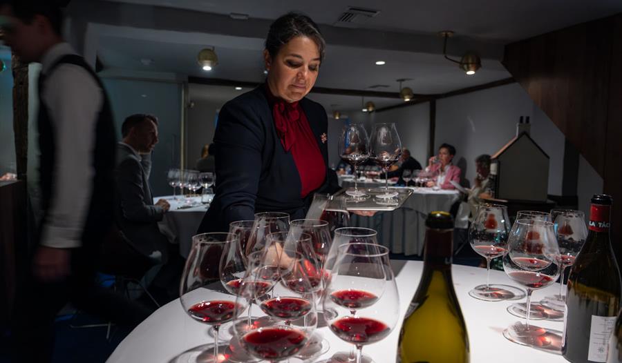 Person with glasses of wine